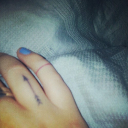 Tiny Black Arrow Tattoo On Finger For Girl
