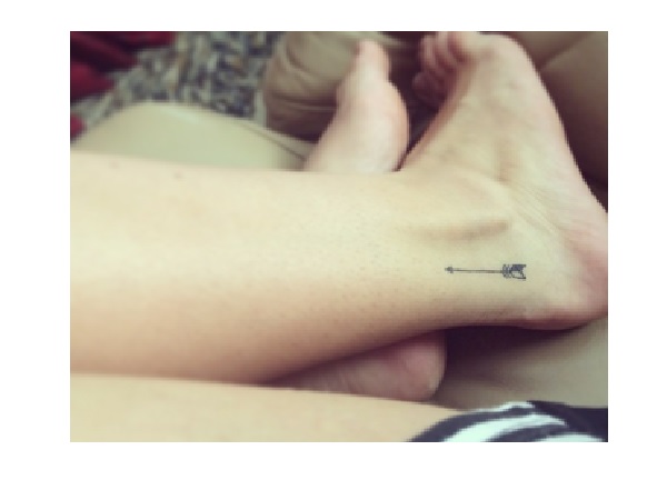 Tiny Upright Arrow Tattoo On Ankle
