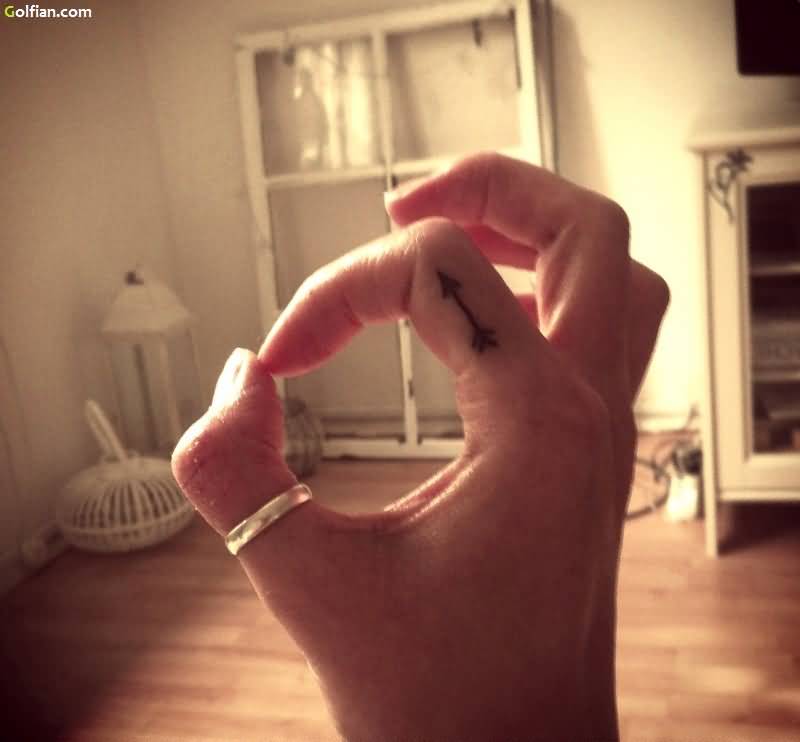Traditional Tiny Arrow Tattoo On Finger