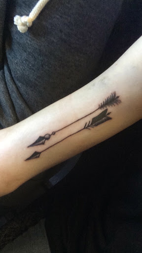 Two Black Arrows Tattoo On Forearm