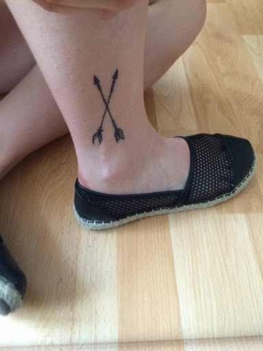 Two Black Crossed Arrows Tattoo On Ankle For Girls