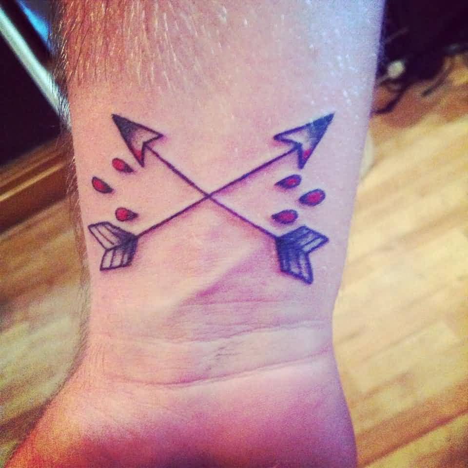 Two Crossed Arrows With Drops Of Blood Tattoo On Wrist
