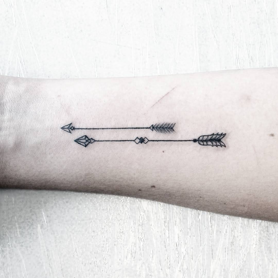 Two Small Arrows Tattoo On Arm