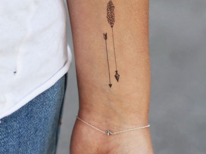 Two Tiny Arrows Tattoo On Wrist