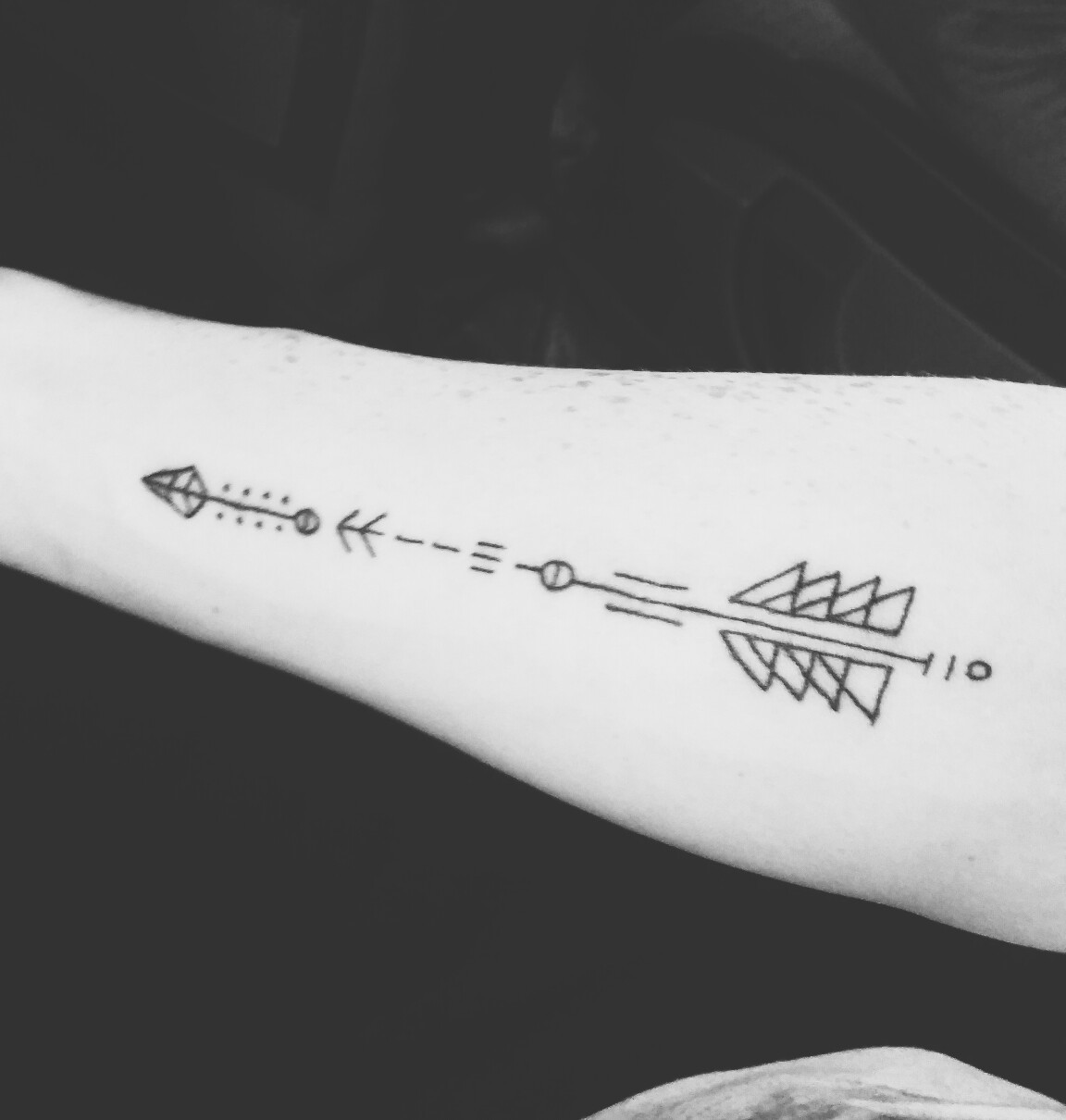 Unique Arrow Tattoo on Forearm