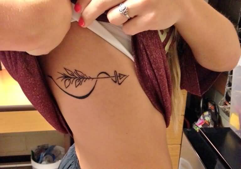 Very Beautifuly Designed Arrow Tattoo On Rib