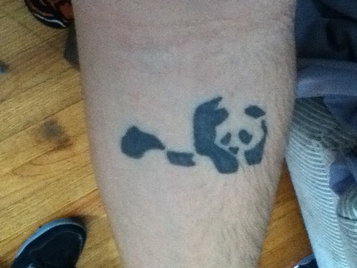 Very Creative Small Tribal Panda Tattoo On Forearm