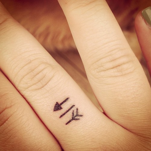Very Cute Smallest Arrow Tattoo On Finger