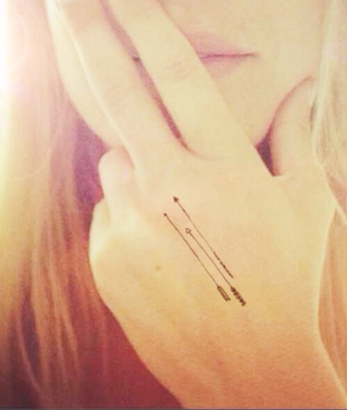 Very tiny Arrows Tattoo On Hand For Girls