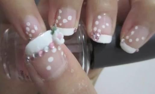 White French Tip Nail With Dots And Rhinestones