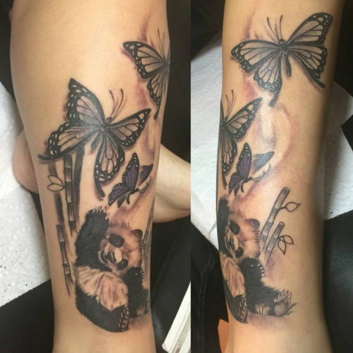 Wonderful Baby Panda With Bamboos And Butterflies Tattoo On Leg