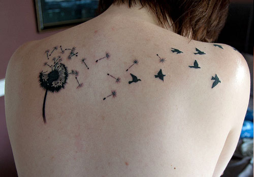 Wonderful Birds Flying From Dandelion Tattoo On Upper Back
