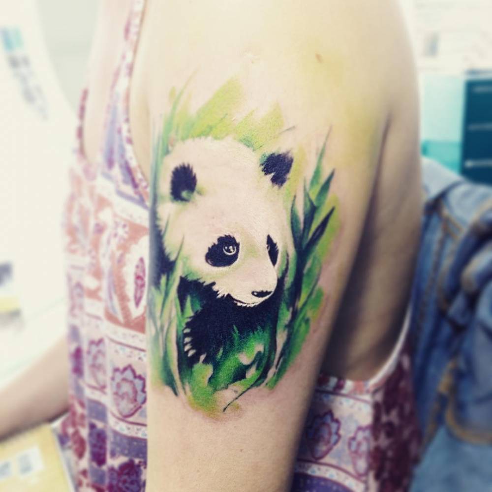 Wonderful Panda With Leaves Tattoo On Left Upper Arm