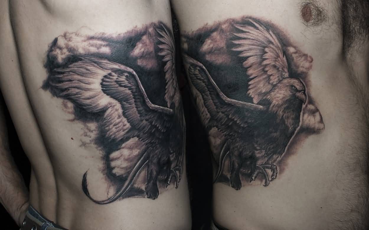 Amazing Black And Grey Griffin Tattoo On Rib