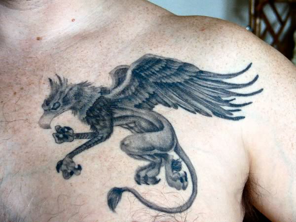 Amazing Grey Ink Griffin Tattoo On Left Side Of Chest