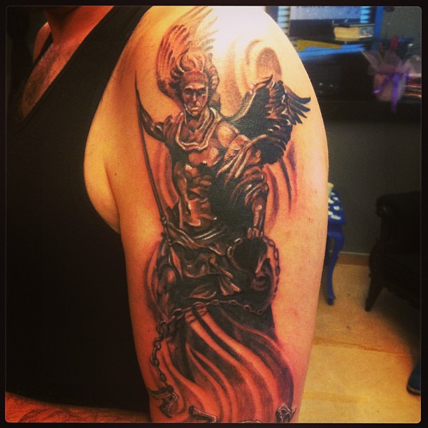 Archangel Tattoo On Left Half Sleeve For Men