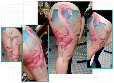 Attractive Flamingo With Triangle Background And Flowers Tattoo On Thigh