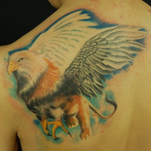Awesome Griffin Tattoo On Left Side Of Upper Back