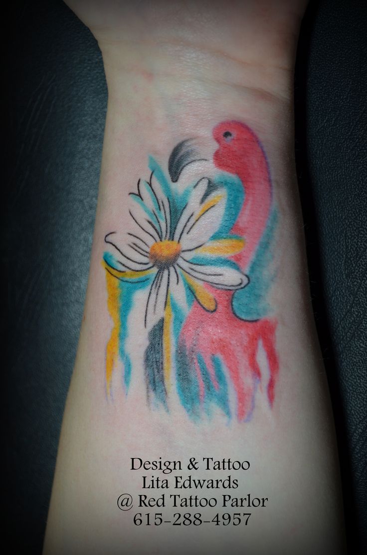 Beautiful Flamingo With Daisy Flower Tattoo On Wrist