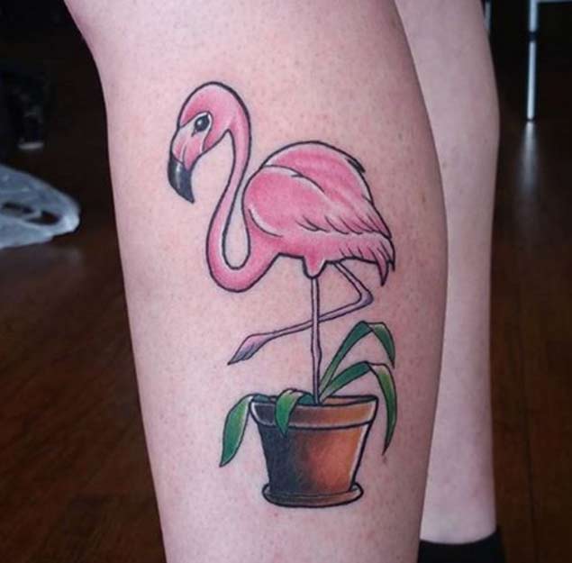 Beautiful Pink Flamingo's Leg In Flower Pot Tattoo