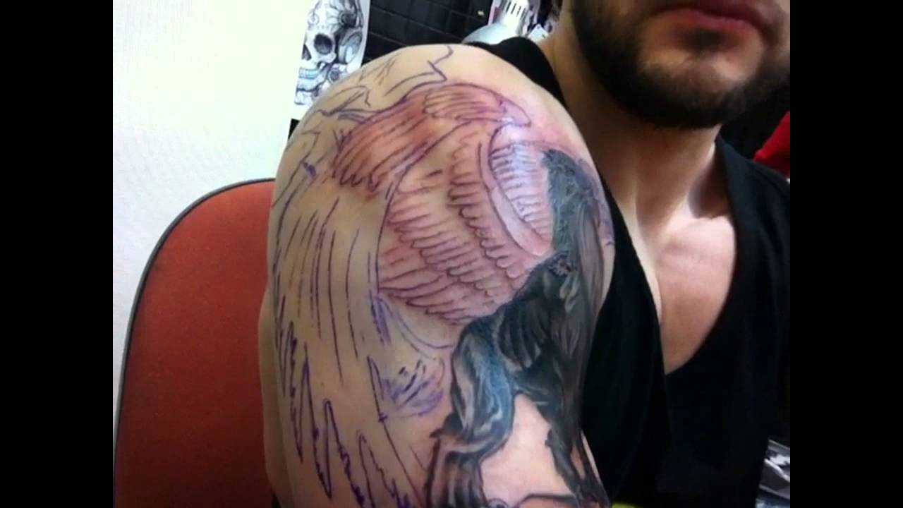 Black Dark Color With Huge Wings Griffin Tattoo On Half Sleeve