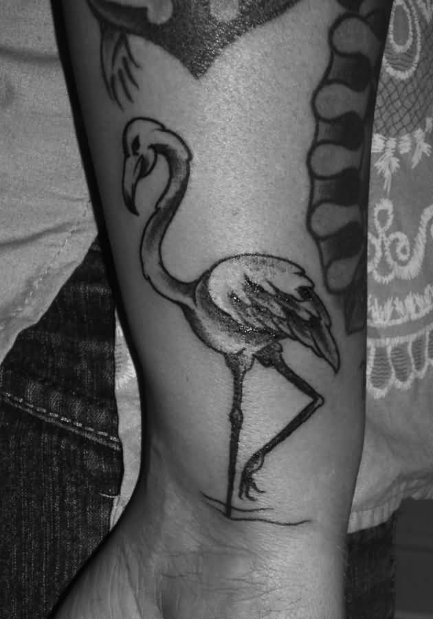 Black Ink Flamingo Tattoo On Wrist