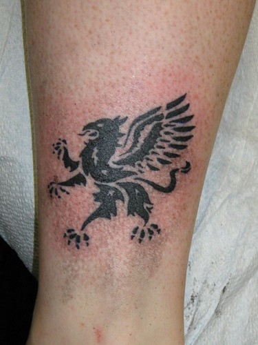 Black Ink Small Griffin Tattoo