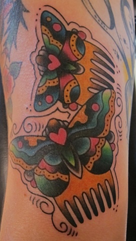 Colored Butterflies And Comb Tattoo On Half Sleeve