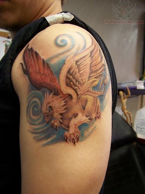 Colored Flying Griffin Tattoo On Shoulder For Men