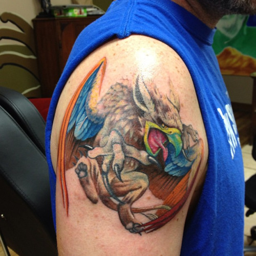 Colorful Angry Griffin Tattoo On Shoulder
