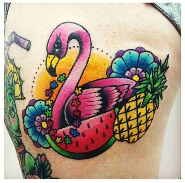 Colorful Flamingo With Pineapple And Blue Flowers Tattoo On Thigh