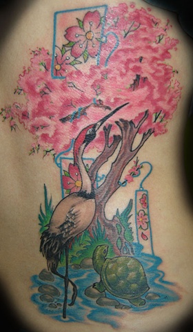 Colorful Flamingo With Turtle And Blossom Tree Tattoo