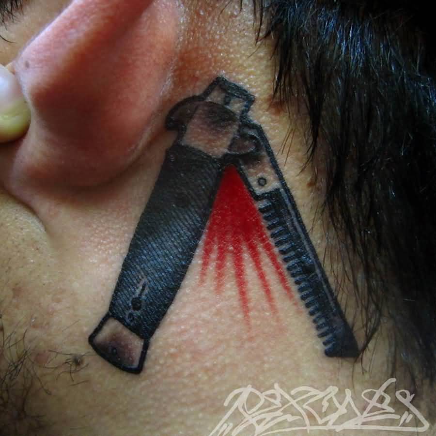 Cool Switch Blade Comb Tattoo On Behind Ear