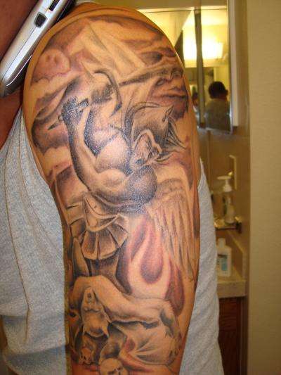 Fighting Archangel Tattoo On Left Sleeve