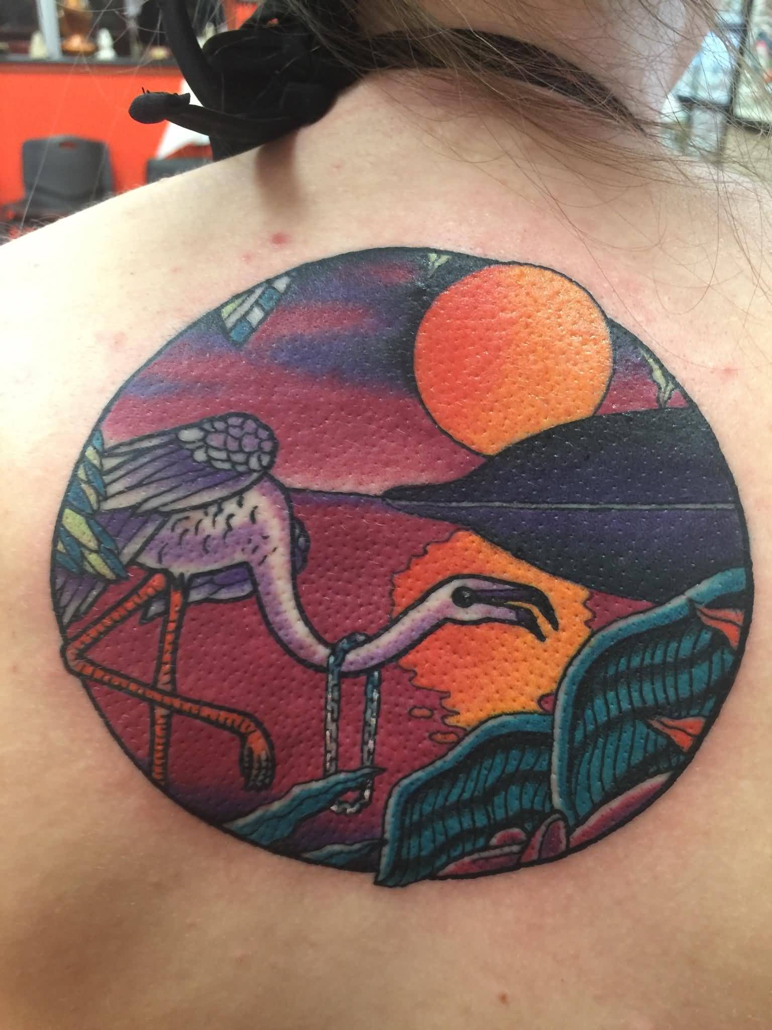Flamingo With Sun And Sea With Island In Circle Tattoo On Upper Back