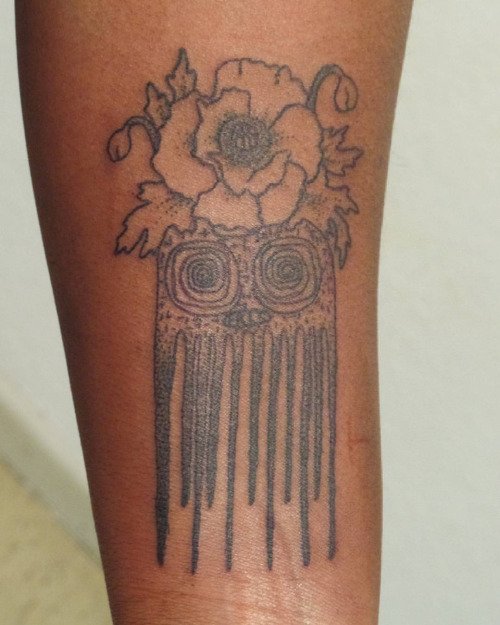 Flowers Designed Comb Tattoo On Wrist