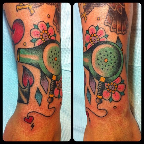 Great Traditional Blow Dryer with Flowers Tattoo On Forearm