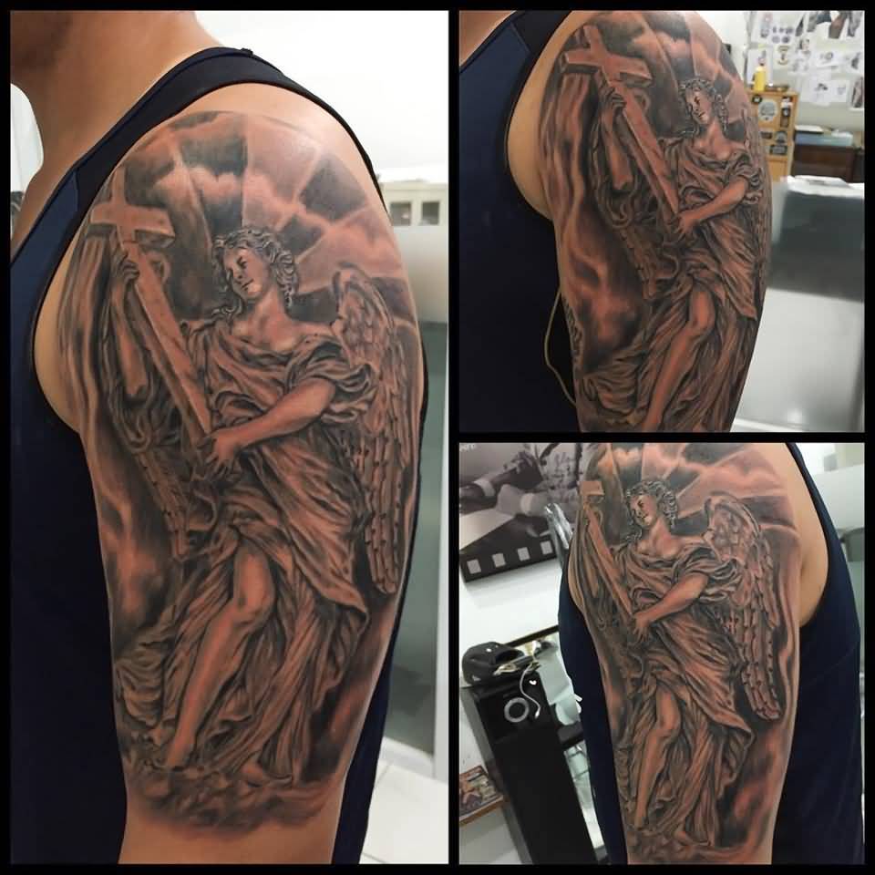 Grey Ink Cross And Archangel Tattoo  On Man Left Half Sleeve