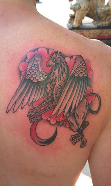 Griffin In Red Color Clouds Tattoo On Back Shoulder