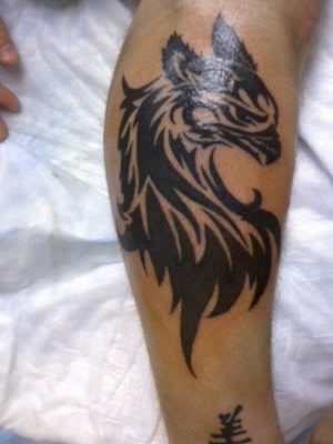 Griffin Tribal Face Tattoo On Forearm