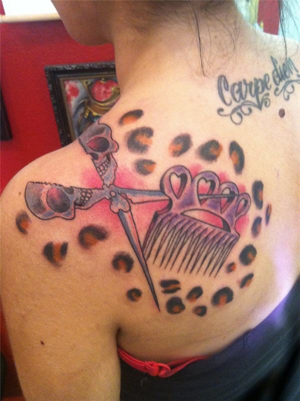Human Skull Headed Scissor With Comb And Cheetah Print Tattoo On Left Back Shoulder