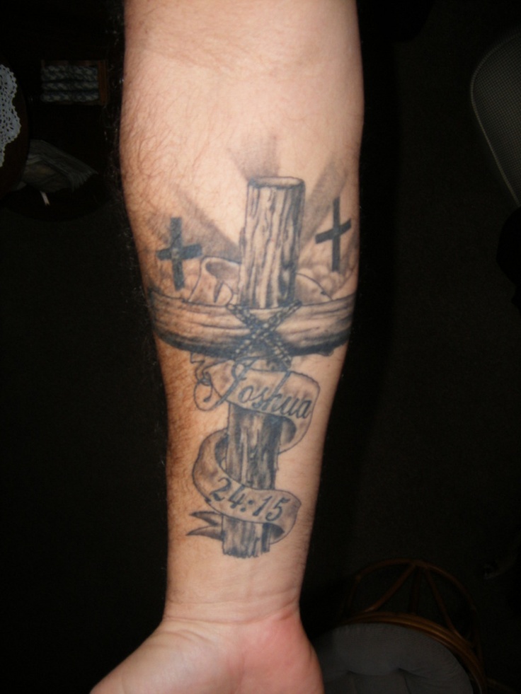 Memorial Banner And Wooden Cross Tattoo On Forearm