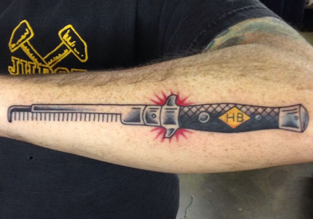 Nice Switchblade Comb Tattoo On Forearm