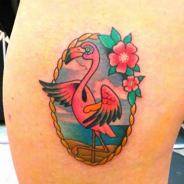 Pretty Pink Flamingo In Nice Frame And Flowers Tattoo