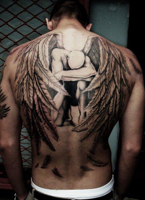 Sad Archangel Tattoo On Man Upper Back