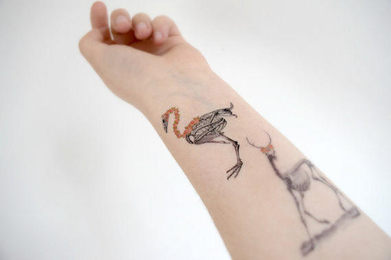 Small Flamingo With Deer Skeleton Tattoo On Forearm