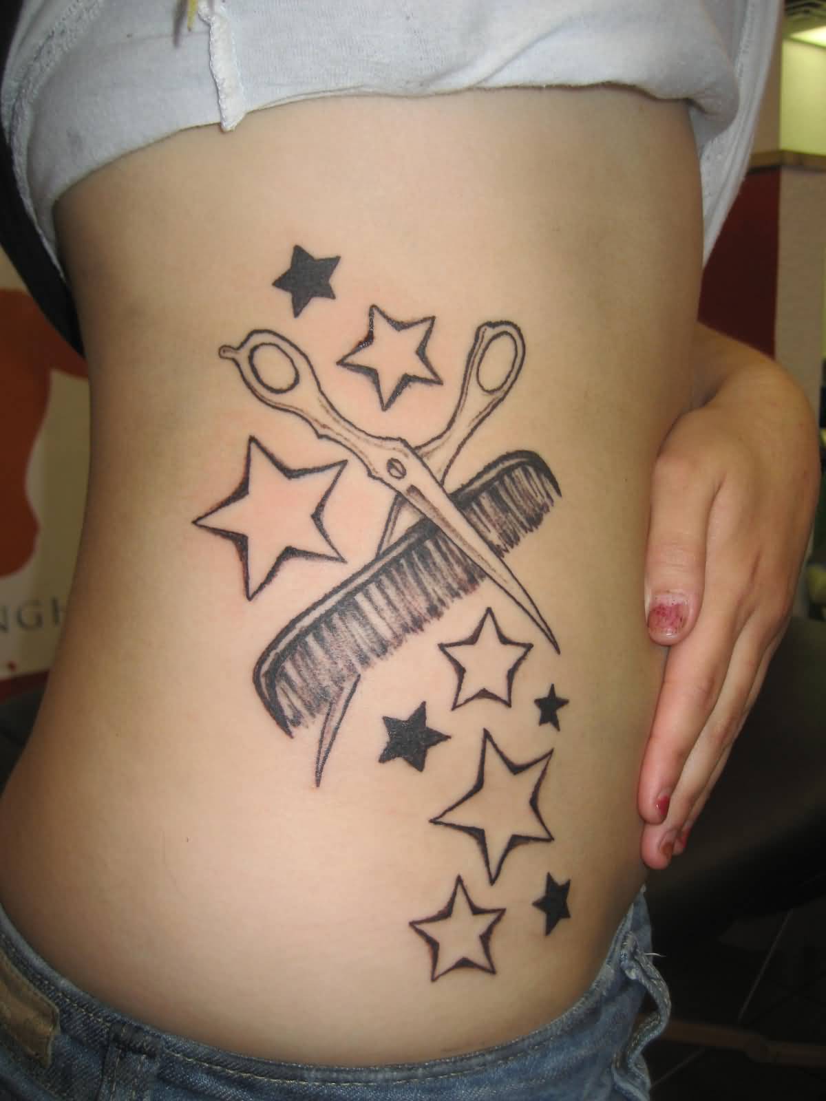 Star Shape With Hair Comb And Scissor Tattoo On Rib