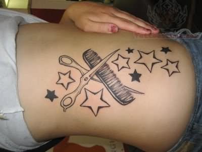 Stars And Grey Ink Comb With Scissor Tattoo On Rib