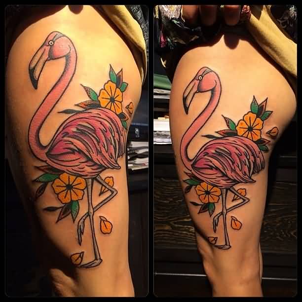 Superb Traditional Flamingo With Flowers Tattoo On Thigh