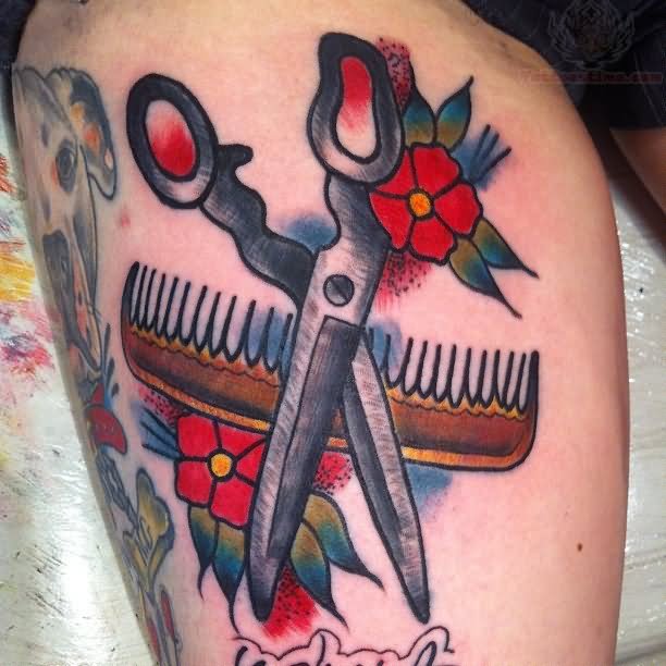 Traditional Comb With Scissor And Red Flowers Tattoo On Thigh